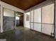 Enclosed porch area with windows and access to the backyard and possible storage at 4487 Berkshire Rd, Forest Park, GA 30297