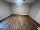 A bedroom featuring wood-look floors and a ceiling fan at 260 Countryside Ln, Covington, GA 30016