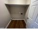 Interior closet space offering a storage shelf and wood-look flooring at 260 Countryside Ln, Covington, GA 30016