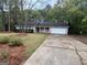 Charming one-story home with a classic design and attached two-car garage at 260 Countryside Ln, Covington, GA 30016