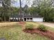 Charming single-story home featuring a well-maintained lawn and a two-car garage at 260 Countryside Ln, Covington, GA 30016