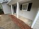 View of the covered front porch entry to this charming home at 260 Countryside Ln, Covington, GA 30016