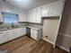 This kitchen has stainless steel appliances and white cabinets at 260 Countryside Ln, Covington, GA 30016