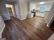 Renovated kitchen features granite countertops and wood floors at 260 Countryside Ln, Covington, GA 30016