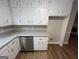 Updated kitchen boasts granite countertops and stainless steel dishwasher at 260 Countryside Ln, Covington, GA 30016