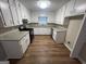 Well-lit kitchen featuring white cabinetry, granite countertops and stainless steel appliances at 260 Countryside Ln, Covington, GA 30016