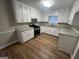Updated kitchen boasting white cabinets, granite countertops, and stainless steel range at 260 Countryside Ln, Covington, GA 30016