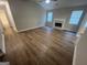 Spacious living room featuring hardwood floors, high ceilings, and a cozy fireplace at 260 Countryside Ln, Covington, GA 30016