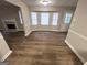 Spacious living room area with fireplace and bay windows at 260 Countryside Ln, Covington, GA 30016