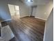 Open floor plan with wood floors leading from the living room to the kitchen at 260 Countryside Ln, Covington, GA 30016