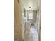 Updated bathroom with marble tile flooring, white vanity, and shower/tub combination at 1322 S Hicks Cir Nw, Conyers, GA 30012