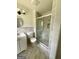 Recently renovated bathroom with glass enclosed shower and stylish vanity at 1322 S Hicks Cir Nw, Conyers, GA 30012