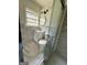 Modern bathroom featuring a vanity, toilet, and glass-enclosed shower with tiled walls at 1322 S Hicks Cir Nw, Conyers, GA 30012