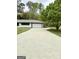 Charming home showcasing a well-maintained driveway and attached carport at 1322 S Hicks Cir Nw, Conyers, GA 30012