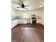 Bright kitchen features stainless steel appliances, white cabinets, and granite countertops at 1322 S Hicks Cir Nw, Conyers, GA 30012