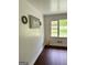 Bright living room with hardwood floors, a window view, and stylish decor at 1322 S Hicks Cir Nw, Conyers, GA 30012