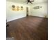 Spacious living room featuring stylish wall decorations and lovely wood floors at 1322 S Hicks Cir Nw, Conyers, GA 30012