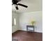 Inviting entryway with hardwood floors, a decorative console table and a ceiling fan at 1322 S Hicks Cir Nw, Conyers, GA 30012