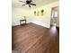 Open living room features console table and view into the bathroom at 1322 S Hicks Cir Nw, Conyers, GA 30012