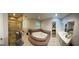 Bathroom with a corner tub, shower, and a vanity, providing a relaxing and functional space at 2387 Shire Ct, Austell, GA 30106