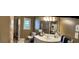 Full bathroom with a single sink vanity, neutral walls, framed mirror, and shower with a patterned curtain at 2387 Shire Ct, Austell, GA 30106