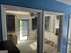 View of an enclosed sunroom with a ceiling fan and blinds, offering a bright and airy space at 2387 Shire Ct, Austell, GA 30106