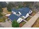 Aerial view of a large home with a circular patio and three-car garage at 2615 Hampton Locust Grove Rd, Locust Grove, GA 30248