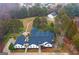 Aerial shot of a beautiful estate with a dark roof and manicured landscaping at 2615 Hampton Locust Grove Rd, Locust Grove, GA 30248