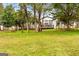 Spacious backyard with a modern home featuring large windows and a wooden fence at 2615 Hampton Locust Grove Rd, Locust Grove, GA 30248