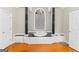 Bright bathroom with a jacuzzi tub between two decorative columns at 2615 Hampton Locust Grove Rd, Locust Grove, GA 30248