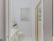 This bathroom features a tiled shower, white vanity, toilet and bright natural lighting at 2615 Hampton Locust Grove Rd, Locust Grove, GA 30248