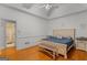 Bright bedroom with hardwood floors, decorative bedframe, and ensuite bathroom at 2615 Hampton Locust Grove Rd, Locust Grove, GA 30248