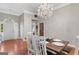 Bright dining room with modern chandelier, natural light, and wooden floors at 2615 Hampton Locust Grove Rd, Locust Grove, GA 30248