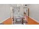 Bright dining room with chandelier, gray walls, and wooden table setting for six at 2615 Hampton Locust Grove Rd, Locust Grove, GA 30248