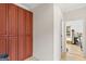 Hallway features a wall of built-in wooden storage cabinets, and access to other rooms at 2615 Hampton Locust Grove Rd, Locust Grove, GA 30248