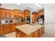 Gourmet kitchen boasts granite countertops, wood cabinetry, and stainless steel appliances at 2615 Hampton Locust Grove Rd, Locust Grove, GA 30248