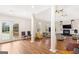 Spacious living room with pillars, wood floors, fireplace, and large windows at 2615 Hampton Locust Grove Rd, Locust Grove, GA 30248