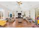 Expansive living room with fireplace, large windows, and wood floors at 2615 Hampton Locust Grove Rd, Locust Grove, GA 30248