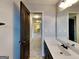 Vanity in the bathroom with a view to the hallway at 483 Castle Top Ln, Lawrenceville, GA 30045