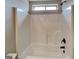 Bright white bathtub and shower combination at 483 Castle Top Ln, Lawrenceville, GA 30045