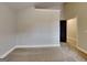 Bedroom featuring neutral carpeting, gray walls, and black door at 483 Castle Top Ln, Lawrenceville, GA 30045