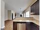 Modern kitchen with granite countertops, stainless steel appliances, and dark cabinetry at 483 Castle Top Ln, Lawrenceville, GA 30045
