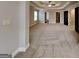 Large main bedroom features tray ceiling, carpet, and access to ensuite bathroom at 483 Castle Top Ln, Lawrenceville, GA 30045
