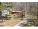 Brick home featuring a driveway, some landscaping, and a partial view of the backyard at 5217 Hollyhock Rd, Douglasville, GA 30135