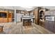 Functional kitchen featuring wood cabinetry, a center island with seating, and appliances at 5217 Hollyhock Rd, Douglasville, GA 30135