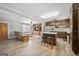 Open-concept living and kitchen area featuring hardwood floors, light-colored walls, and a kitchen island at 5217 Hollyhock Rd, Douglasville, GA 30135