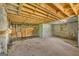 Unfinished basement offers ample space and potential with exposed wood beams, stone walls, and classic architectural features at 2255 Beecher Sw Rd, Atlanta, GA 30311