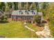 Charming home features brick exterior, a gabled roof, well-kept lawn, and an inviting pathway leading to the entrance at 2255 Beecher Sw Rd, Atlanta, GA 30311