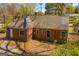Brick home showcasing classic architecture, lush landscaping and a solid structure with enduring appeal at 2255 Beecher Sw Rd, Atlanta, GA 30311