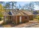 Charming brick home with a screened-in porch, surrounded by mature trees, offering a cozy retreat at 2255 Beecher Sw Rd, Atlanta, GA 30311